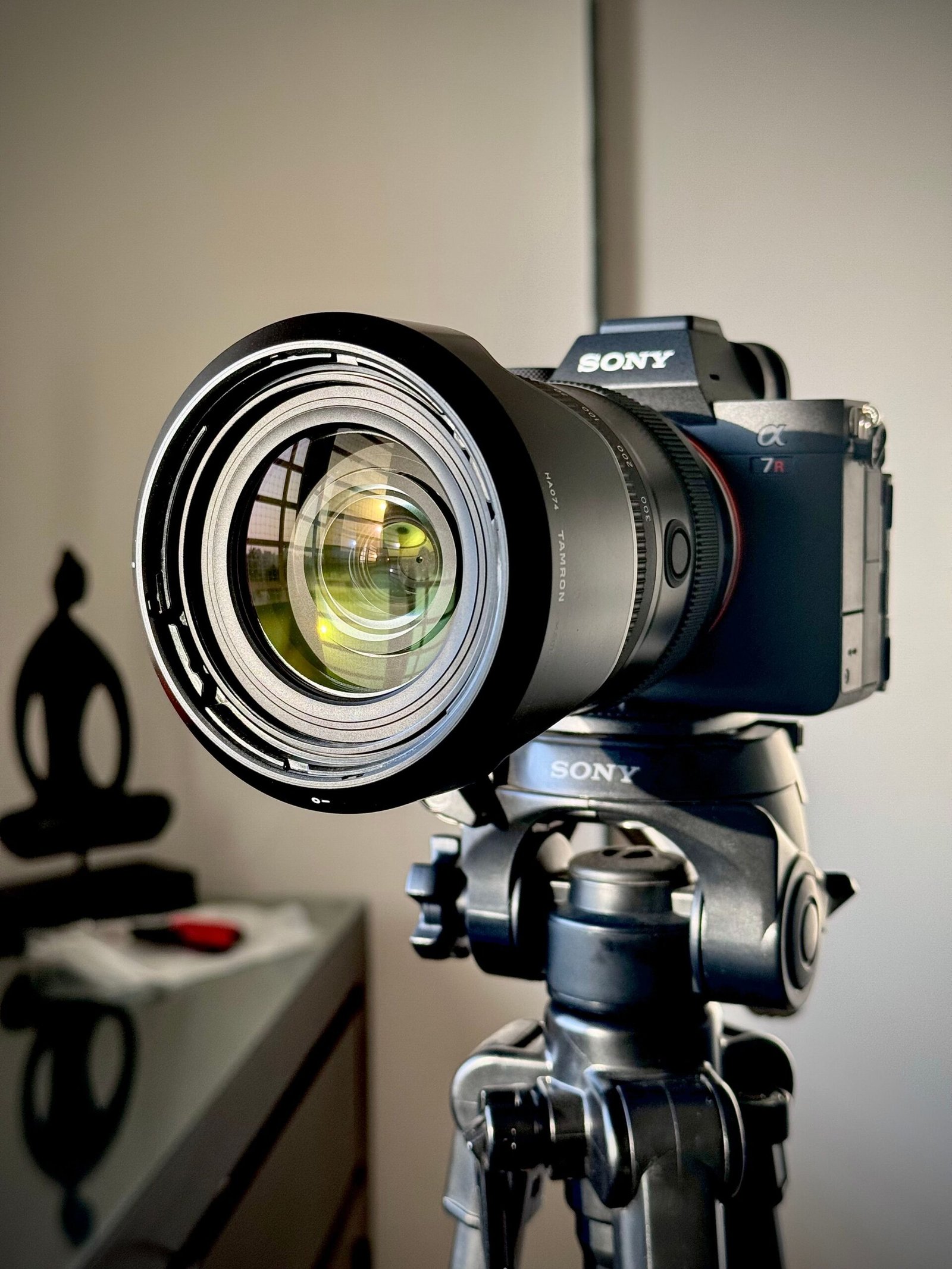 Close-up of a professional camera on a tripod indoors, ideal for studio shoots.